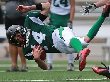 North's Ryan Krupski falls with the ball during 6 Man Ed Henick Senior Bowl action at SMF Field in Saskatoon on May 23, 2016.