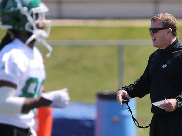 Coach Chris Jones speaks to players during day one of Riders training camp at Griffiths Stadium in Saskatoon, May 29, 2016.