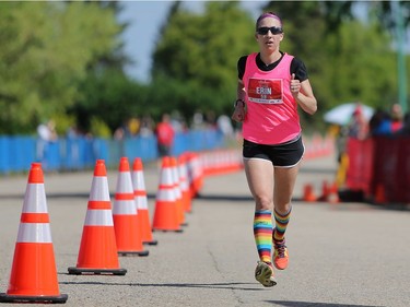 Erin Gardiner is the first woman marathon runner to cross the finish line with a time of 3:04:34 at the Saskatchewan Marathon at Deifenbaker Park in Saskatoon on May 29, 2016.