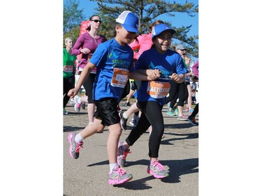 Khailie and Laetissya Thompson run the 5km at the Saskatchewan Marathon at Deifenbaker Park in Saskatoon on May 29, 2016.