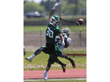 Malcolm Cyrus misses a catch during day one of Riders training camp at Griffiths Stadium in Saskatoon, May 29, 2016.