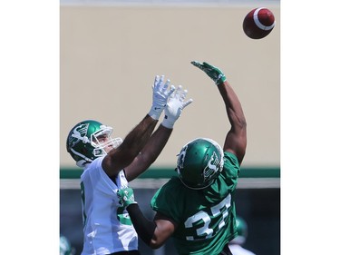 Tyree Hollins tries to block the ball from Alec Lemon during day one of Riders training camp at Griffiths Stadium in Saskatoon, May 29, 2016.