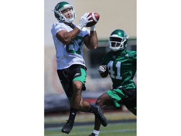 Tyree Hollins tries to block the ball from Alec Lemon during day one of Riders training camp at Griffiths Stadium in Saskatoon, May 29, 2016.