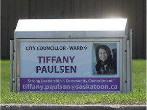 City Councillor Tiffany Paulsen is pictured on a bus stop sign rental at McKercher and 8th Street in Saskatoon on May 3, 2016. (Michelle Berg / Saskatoon StarPhoenix)