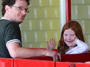 Seven-year-old Lily Laycock and her dad enjoy the first CP railway ride of the season at Kinsmen Park on May 8, 2016.