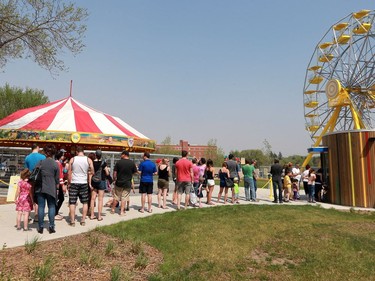 People line up for tickets on opening day at Kinsmen Park on May 8, 2016.