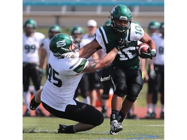 U of S Huskies' Jarvis James protects the ball during first half action to close out their spring camp at Griffith's Stadium on May 8, 2016.