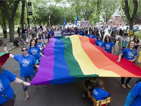 People travel on floats down Spadina Crescent during the Pride Parade in Saskatoon on Saturday June 13th, 2015.