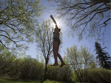 Kenzie Frizzle was hanging out in the sun at Ashworth Holmes Park, doing some slack lining and acrobatics, May 4, 2016.