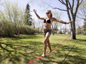 Kenzie Frizzle was hanging out in the sun at Ashworth Holmes Park, doing some slack lining and acrobatics, Wednesday, May 04, 2016.