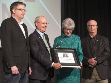 Ron and Jane Graham receive the Huskies Ambassador Award on stage during the annual Huskies Dog's Breakfast event at Prairieland Park, May 5, 2016.