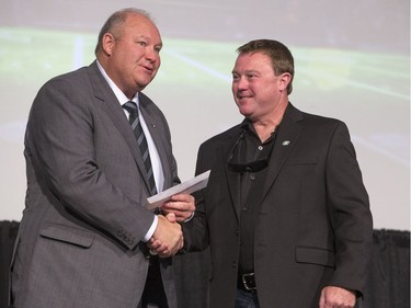 Huskies coach Brian Towriss (L) and Roughriders head coach Chris Jones during the annual Huskies Dog's Breakfast event at Prairieland Park, May 5, 2016.