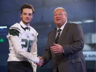 Recruit Joel Seiferling of Warman is welcomed by Huskies head coach Brian Towriss during the annual Huskies Dog's Breakfast event at Prairieland Park, May 5, 2016.