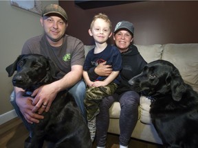 Fort McMurray fire evacuees Sheldon Morgan and wife Kelly Frasz Morgan with son Chace and dogs Raven and Hunter, in the home of family in Saskatoon, Tuesday, May 10, 2016.