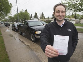 Doug Daniels got a ticket for leaving his truck on the street in front of his house and thinks the 36-hour limit for street parking is outdated. He posed at the location on Preston Avenue, on May 10, 2016.
