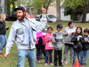 SUM Theatre kicked off its Theatre in the Park season with a fun relay event in Thornton Park involving school kids from St. Frances school, May 12, 2016. The event was in celebration of the new production called Little Badger and The Fire Spirit. Here Sum Director Joel Bernbaum motivates students in the piggyback race.