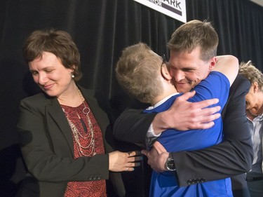 Charlie Clark hugs son Simon after he announced his bid for mayor during a packed event at the Bessborough Hotel, May 18, 2016.