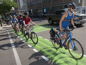 A crowd of riders attended the grand opening of the new 4th Avenue Protected Bike Lanes at city hall, Thursday, May 19, 2016.