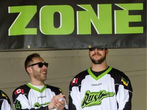 Saskatchewan Rush forward Mark Matthews finds his 6-foot-5 height to be a detriment during Friday's downtown rally, as teammate Ryan Dilks looks on.