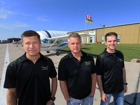 Mitchinson Flying Service owners Jim Guenther, from left, Dale Tiedeman and Dan Glass at the business, on May 27, 2016. Mitchinson is celebrating its 70th anniversary.