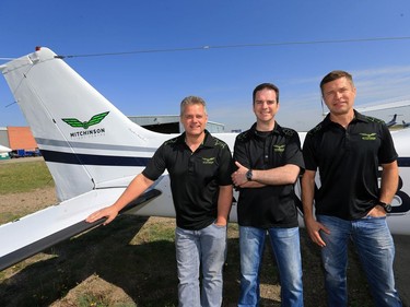 L-R: Mitchinson Flying Service owners Dale Tiedeman, Dan Glass and Jim Guenther at the business, May 27, 2016.  Mitchinson is celebrating its 70th anniversary.