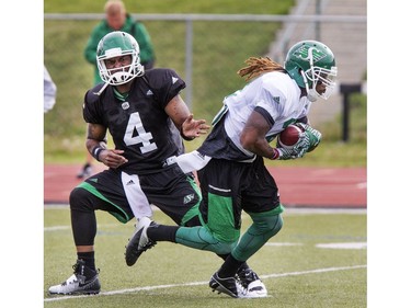 Quarterback Darian Durant hands off the ball during Saskatchewan Roughriders training camp at Griffiths Stadium, May 30, 2016.