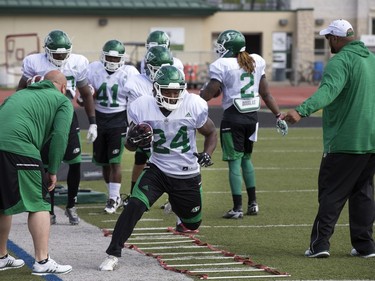 Troy Adams with the ball in a drill during Saskatchewan Roughriders training camp at Griffiths Stadium, May 30, 2016.