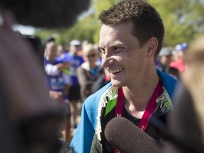 Sergii Vashurin speaks to media after finishing first at last year's Saskatchewan Marathon.