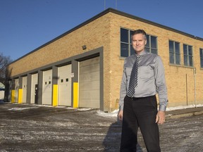 Charles Olfert, an architect with AOBDT, poses outside the city bus barns on Avenue D North on Nov. 30, 2015