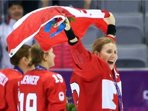 Hayley Wickenheiser enjoys the moment as Team Canada celebrates its gold-medal win USA in overtime in the women's hockey event at the Sochi 2014 Olympic Games, February 20, 2014