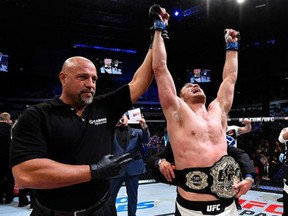 Stipe Miocic celebrates after defeating Fabricio Werdum of Brazil by KO in their UFC heavyweight championship bout during the UFC 198 event at Arena da Baixada stadium on May 14, 2016 in Curitiba, Parana, Brazil. (Josh Hedges/Zuffa LLC via Getty Images)