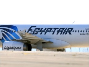 The side of an an EgyptAir Airbus A-320 sitting on the tarmac of Larnaca airport can be seen after it was fter it was hijacked and diverted to Cyprus on March 29, 2016.