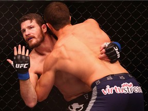 Michael Bisping appeals to the referee after being cut above the eye by Luke Rockhold in their middleweight fight during UFC Fight Night 55 at Allphones Arena on November 8, 2014 in Sydney, Australia.