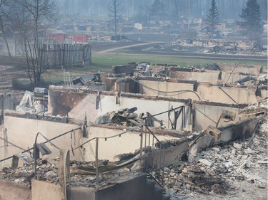 Home foundations are all that remain in a residential neighbourhood destroyed by a wildfire on May 6, 2016 in Fort McMurray, Alberta. Wildfires, which are still burning out of control, have forced the evacuation of more than 80,000 residents from the town.
