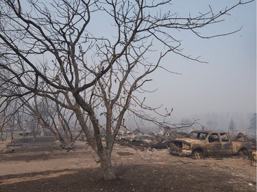 Home foundations and shells of vehicles are nearly all that remain in a residential neighbourhood destroyed by a wildfire on May 6, 2016 in Fort McMurray, Alberta. Wildfires, which are still burning out of control, have forced the evacuation of more than 80,000 residents from the town.