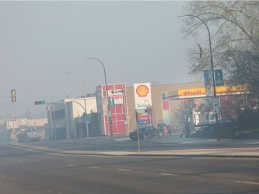 Smoke from wildfires fill the morning air near a gas station on May 6, 2016 in Fort McMurray, Alberta. Wildfires, which are still burning out of control, have forced the evacuation of more than 80,000 residents from the town.