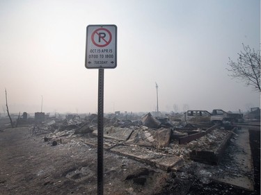 Home foundations and shells of vehicles are nearly all that remain in a residential neighbourhood destroyed by a wildfire on May 6, 2016 in Fort McMurray, Alberta. Wildfires, which are still burning out of control, have forced the evacuation of more than 80,000 residents from the town.
