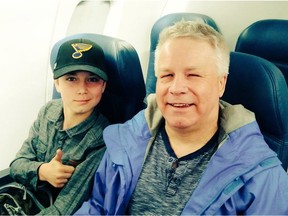 Wyatt Nelson gives the thumbs up while on the plane to St. Louis with his dad, Gerry.