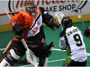 Bandits Anthony Cosmo makes a save on a shot from Saskatchewan Rush's Curtis Knight in the first half during Game One of best-of-three Champion's Cup final at First Niagara Center in Buffalo, NY on Saturday,May 28, 2016.  (James P. McCoy/ Buffalo News)