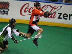 Bandits David Brock fly's in the air while shooting the ball on Saskatchewan Rush's Aaron Bold in the first half during Game 1 of best-of-three Champion's Cup final at First Niagara Center in Buffalo, NY on Saturday,May 28, 2016.