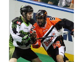 Bandits  Dhane Smith battles Saskatchewan Rush's Ryan Dilks for the ball in the first half during Game One of best-of-three Champion's Cup final at First Niagara Center in Buffalo, NY on Saturday,May 28, 2016.  (James P. McCoy/ Buffalo News))
