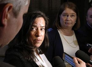 Minister of Justice Jody Wilson-Raybould and Health Minister Jane Philpott, right, talk to reporters outside the House of Commons on Tuesday May 31, 2016 in Ottawa. Wilson-Raybould likes to cite the case of E.F. when she warns of the danger that will exist as of 12:00 a.m. Monday, when medically assisted dying becomes legal in Canada without any law in place to impose safeguards. THE CANADIAN PRESS/Fred Chartrand