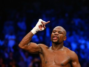Floyd Mayweather Jr. reacts after the 12th round against Manny Pacquiao in their welterweight unification championship bout on May 2, 2015 at MGM Grand Garden Arena in Las Vegas, Nevada.