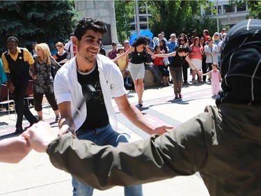 Abdullah Seif Aldeen celebrates World Refugee Day put on by the Saskatoon Refugee Coalition at Civic square at City Hall in Saskatoon on June 20, 2016.