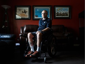 Brian Cale is pictured at his home in Beaumont, Alta., on Wednesday, June 15, 2016. Cole, now 42, was in the lead a year ago during a bicycle race in Saskatoon when he lost control, hit a tree and broke his back.