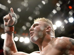 Brock Lesnar celebrates after defeating Frank Mir in their heavyweight title bout at UFC 100 at Mandalay Bay in Las Vegas Saturday, July 11, 2009.