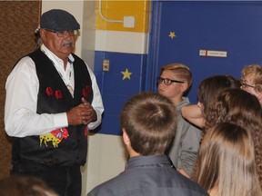 Member of the Truth and Reconciliation Commission of Canada's Indian Residential School Survivor Committee, Eugene Arcand, can be seen speaking to Gr. 7 students at St. Augustine School, on Monday afternoon. The conversation came following a screening of the Grade 7 produced movie, called A Caretaker's Story, which helped children at the school learn about the impact of Canada's residential school system.