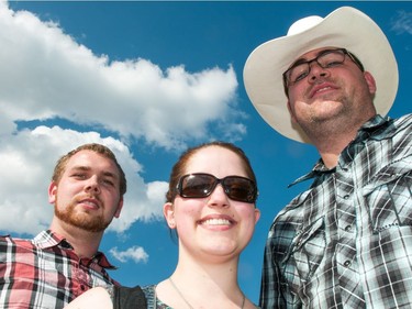 Derek Nelson (L), Angela Douglas and Patrick Douglas made the trip to Saskatoon from near Red Deer, Alberta to see Thursday night's Garth Brooks concert, June 9, 2016.