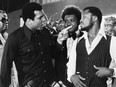 FILE - In this July 17, 1975, file photo, sports promoter Don King stands between Muhammad Ali, left, the heavyweight champion, and Joe Frazier in New York. Ali, the magnificent heavyweight champion whose fast fists and irrepressible personality transcended sports and captivated the world, has died according to a statement released by his family Friday, June 3, 2016. He was 74. (AP Photo/File) ORG XMIT: NY206