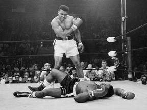 FILE - In this May 25, 1965, file photo, heavyweight champion Muhammad Ali, then known as Cassius Clay, stands over challenger Sonny Liston, shouting and gesturing shortly after dropping Liston with a short hard right to the jaw, in Lewiston, Maine. Ali, the magnificent heavyweight champion whose fast fists and irrepressible personality transcended sports and captivated the world, has died according to a statement released by his family Friday, June 3, 2016. He was 74.